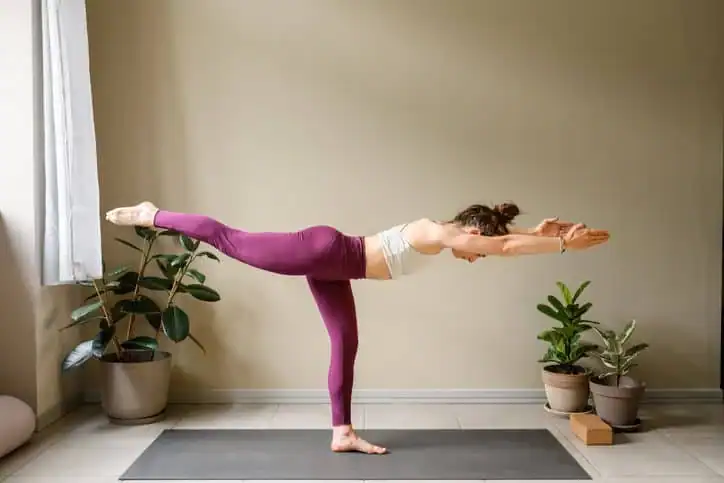 Woman doing Yoga exercise Harwich to help with toning the body. 
