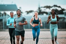 Sculpting Sleek Arms: The Essential Role of Cardio in Toning Without Bulking Up 3 image of people running to incorporate cardio Harwich exercise into their life to help tone arms and body.